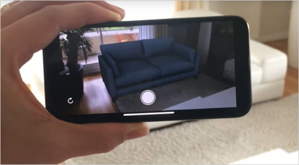 image of camera showing augmented reality picture of a couch.