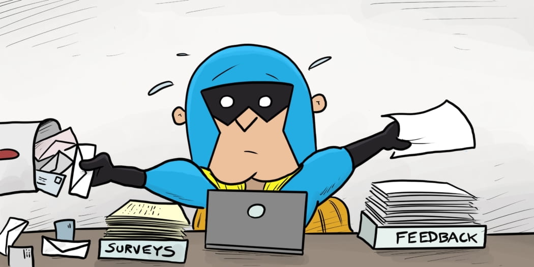 Image showing Dev Man sorting through feedback, flustered at his desk