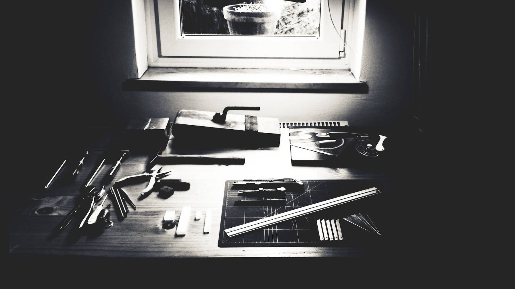 Workbench with various tools sitting on it.